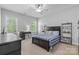 Bright bedroom with natural light, desk, and storage shelving, perfect for organization and productivity at 2569 Lower Assembly Dr, Fort Mill, SC 29708