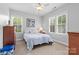 Bedroom with windows providing lots of light, bed, ceiling fan and dresser at 2569 Lower Assembly Dr, Fort Mill, SC 29708