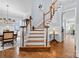Elegant foyer with hardwood floors, a staircase, and views of the dining room at 2569 Lower Assembly Dr, Fort Mill, SC 29708