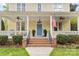Inviting front porch with classic details and ceiling fans at 2569 Lower Assembly Dr, Fort Mill, SC 29708