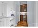 Custom butler's pantry with wine fridge, and wet bar at 2569 Lower Assembly Dr, Fort Mill, SC 29708