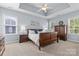Comfortable main bedroom with trey ceiling, carpet, and double windows providing lots of light at 2569 Lower Assembly Dr, Fort Mill, SC 29708
