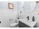 Powder room featuring shiplap wall, modern vanity and fixtures, and round mirror at 2569 Lower Assembly Dr, Fort Mill, SC 29708