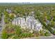 Stunning aerial view of luxurious condos surrounded by lush greenery, with Charlotte skyline in the distance at 2823 Providence Rd # 143, Charlotte, NC 28211