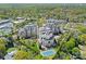 Aerial view showcasing upscale condos with pool and tennis court amenities amidst a tree-lined neighborhood at 2823 Providence Rd # 143, Charlotte, NC 28211