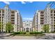 Elegant condo buildings with balconies and a beautifully landscaped entrance, exuding sophistication and charm at 2823 Providence Rd # 143, Charlotte, NC 28211