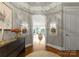 Inviting foyer with arched doorway, hardwood floors, and stylish decor, creating a warm and welcoming ambiance at 2823 Providence Rd # 143, Charlotte, NC 28211