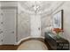 Welcoming foyer features hardwood floors, a decorative rug, and elegant lighting at 2823 Providence Rd # 143, Charlotte, NC 28211