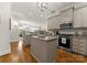 Modern kitchen featuring stainless steel appliances, granite countertops, and a center island at 2823 Providence Rd # 143, Charlotte, NC 28211
