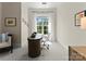 Home office with a large window, modern desk, and a comfortable seating area at 2823 Providence Rd # 143, Charlotte, NC 28211