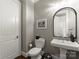 Chic powder room boasts a pedestal sink, modern fixtures, and a tastefully decorated mirror at 2823 Providence Rd # 143, Charlotte, NC 28211
