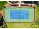 Aerial view of a well-maintained tennis court, surrounded by lush greenery and landscaping at 2823 Providence Rd # 143, Charlotte, NC 28211