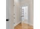 Hallway view into updated bathroom with shower and built in shelves at 319 Chestnut St, Rock Hill, SC 29730