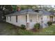 Exterior view of a quaint house with covered porch, perfect for relaxing and enjoying the neighborhood at 319 Chestnut St, Rock Hill, SC 29730