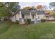 Charming home with a welcoming front porch, white siding, and well-maintained landscaping at 319 Chestnut St, Rock Hill, SC 29730