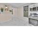 Bright kitchen with marble floors, stainless steel appliances, and an abundance of natural light from the window at 319 Chestnut St, Rock Hill, SC 29730