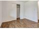 This bedroom offers wood-look floors, a closet and plenty of natural light at 322 Electra Ln, Stanley, NC 28164