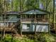 Exterior of home with decks, showing its elevated position in a natural setting at 322 Electra Ln, Stanley, NC 28164