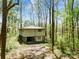Exterior view of home surrounded by tall trees, showcasing its architectural design at 322 Electra Ln, Stanley, NC 28164