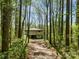 Secluded house surrounded by lush trees offers privacy and a connection with nature at 322 Electra Ln, Stanley, NC 28164