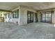 Covered porch with entry door and screened access to wooded property at 322 Electra Ln, Stanley, NC 28164