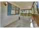 Side porch with exterior access and view of wooded property at 322 Electra Ln, Stanley, NC 28164