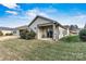 A view of the backyard featuring a covered patio with an outdoor grill and sliding glass doors at 322 Flat Rock Dr, Denver, NC 28037