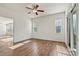 Bedroom with hardwood floors, neutral walls, and sliding glass doors to outdoor space at 322 Flat Rock Dr, Denver, NC 28037