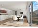 Dining area seamlessly connects to a modern kitchen, perfect for gatherings at 322 Flat Rock Dr, Denver, NC 28037