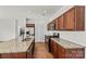 Bright kitchen equipped with stainless steel appliances and granite countertops at 322 Flat Rock Dr, Denver, NC 28037