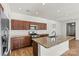 Modern kitchen featuring a granite countertop island and stainless steel appliances at 322 Flat Rock Dr, Denver, NC 28037