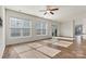 Bright living room with hardwood floors, ceiling fan, and sliding glass doors to outdoor space at 322 Flat Rock Dr, Denver, NC 28037