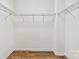 Walk-in closet with hardwood floors and wire shelving at 322 Flat Rock Dr, Denver, NC 28037