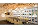 Unique wine cellar featuring climate-controlled storage, a long table, and distinctive wood ceiling at 322 Flat Rock Dr, Denver, NC 28037