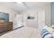 Bedroom with neutral decor, featuring a dresser, mirror and access to closet and bathroom at 3224 Selwyn Farms Ln # 3, Charlotte, NC 28209