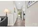 Hallway leading to rooms featuring a colorful rug and decor at 3224 Selwyn Farms Ln # 3, Charlotte, NC 28209