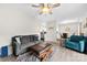 Spacious living room with a ceiling fan, couch, and dining area nearby at 3224 Selwyn Farms Ln # 3, Charlotte, NC 28209