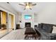 Cozy living room features a fireplace and sliding glass door to the patio at 3224 Selwyn Farms Ln # 3, Charlotte, NC 28209