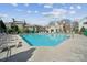 Community pool with lounge chairs, a perfect spot for relaxation and summer fun at 3224 Selwyn Farms Ln # 3, Charlotte, NC 28209