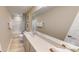 Bright bathroom featuring a single vanity, a tub with shower, and neutral color palette at 3252 Maya Ln # 46, Midland, NC 28107