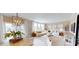 Open-concept living room, adjacent to the dining room, features a neutral color palette, large windows, and modern lighting at 3252 Maya Ln # 46, Midland, NC 28107