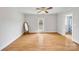 Spacious bedroom with hardwood floors, a large window and a mirror at 382 Cole Campbell Rd, Taylorsville, NC 28681