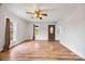 Bright living room with beautiful hardwood floors and updated ceiling fan at 382 Cole Campbell Rd, Taylorsville, NC 28681