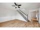 Bright living room with hardwood floors and a staircase leading upstairs at 382 Cole Campbell Rd, Taylorsville, NC 28681