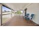 Covered porch featuring two chairs, wood flooring, and a white railing at 382 Cole Campbell Rd, Taylorsville, NC 28681