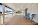 Covered porch featuring two chairs, wood flooring, and a white railing at 382 Cole Campbell Rd, Taylorsville, NC 28681