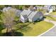 Aerial view showing the house surrounded by a well-maintained lawn and greenery at 408 Harvest Ter, Clover, SC 29710