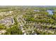 An aerial view of the residential neighborhood with lush greenery and a nearby lake at 408 Harvest Ter, Clover, SC 29710