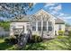 Backyard featuring the deck, sunroom, and greenery at 408 Harvest Ter, Clover, SC 29710