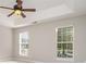 Bedroom features a tray ceiling, ceiling fan, and natural lighting at 408 Harvest Ter, Clover, SC 29710